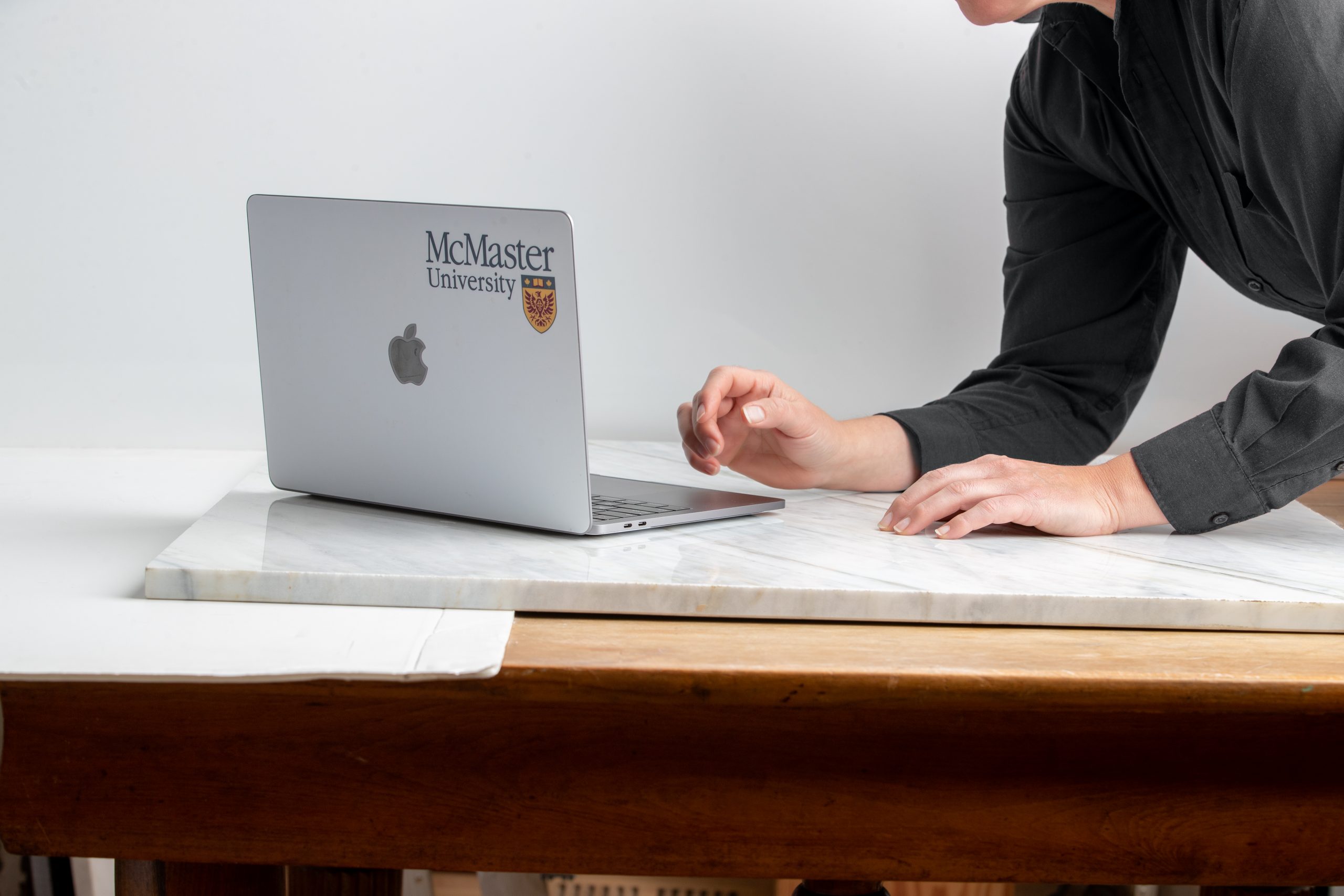 Student typing on laptop