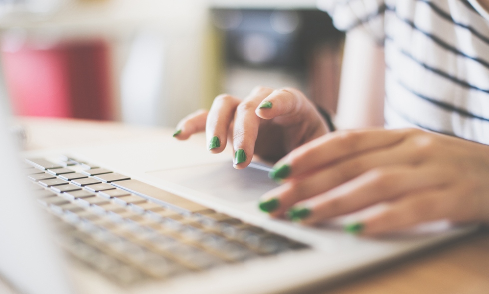Person typing on laptop