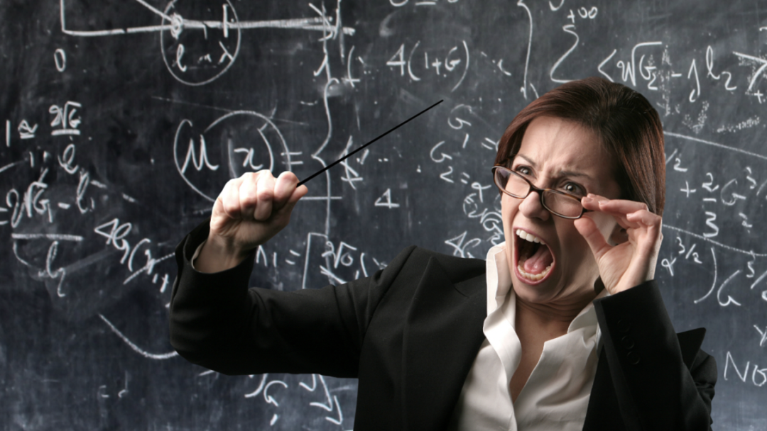 Feature image Angry teacher yelling in front of chalkboard
