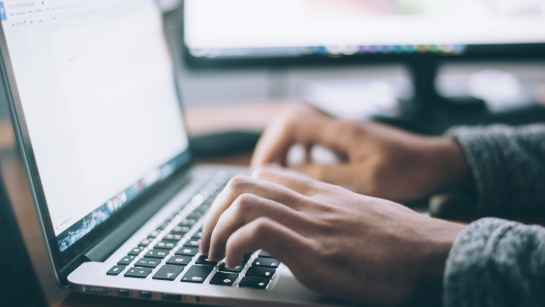 Hand typing on Keyboard