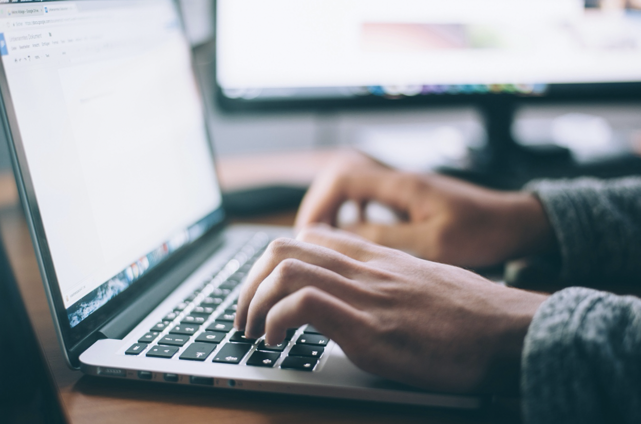 Hand typing on Keyboard