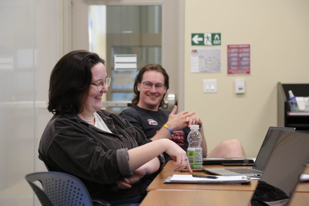 Participants engage in discussion during the Course (re)Design Workshop.