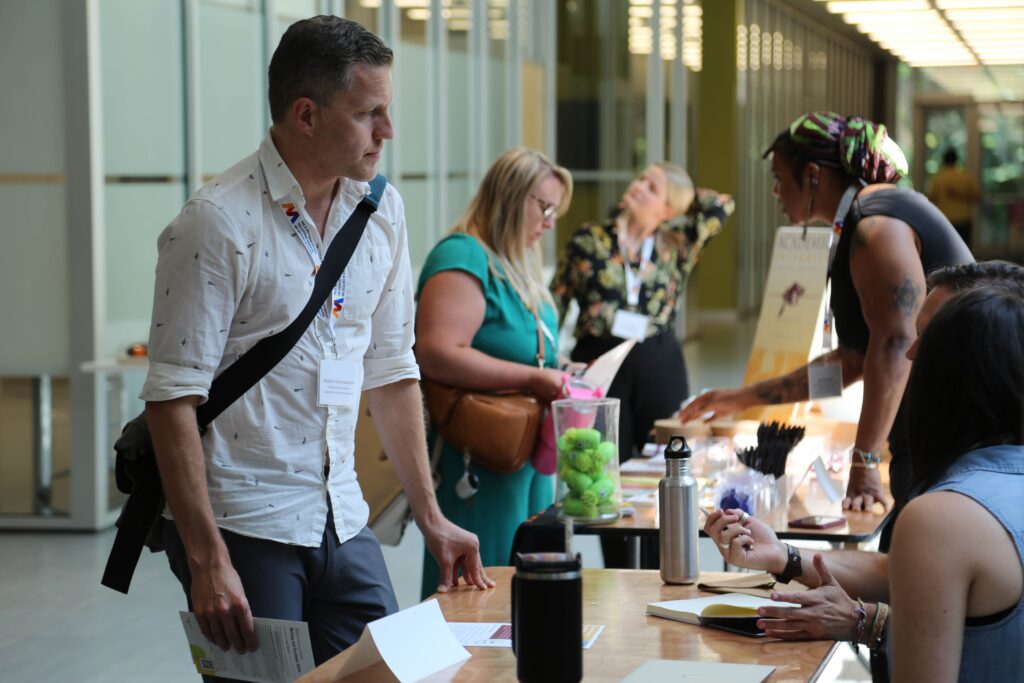 New faculty members visit the resource fair at New Faculty Orientation in August 2024.
