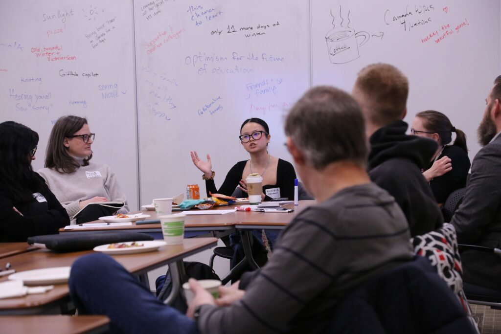 Students and faculty members discuss their projects at the Student Partners Check-In event in February 2025.