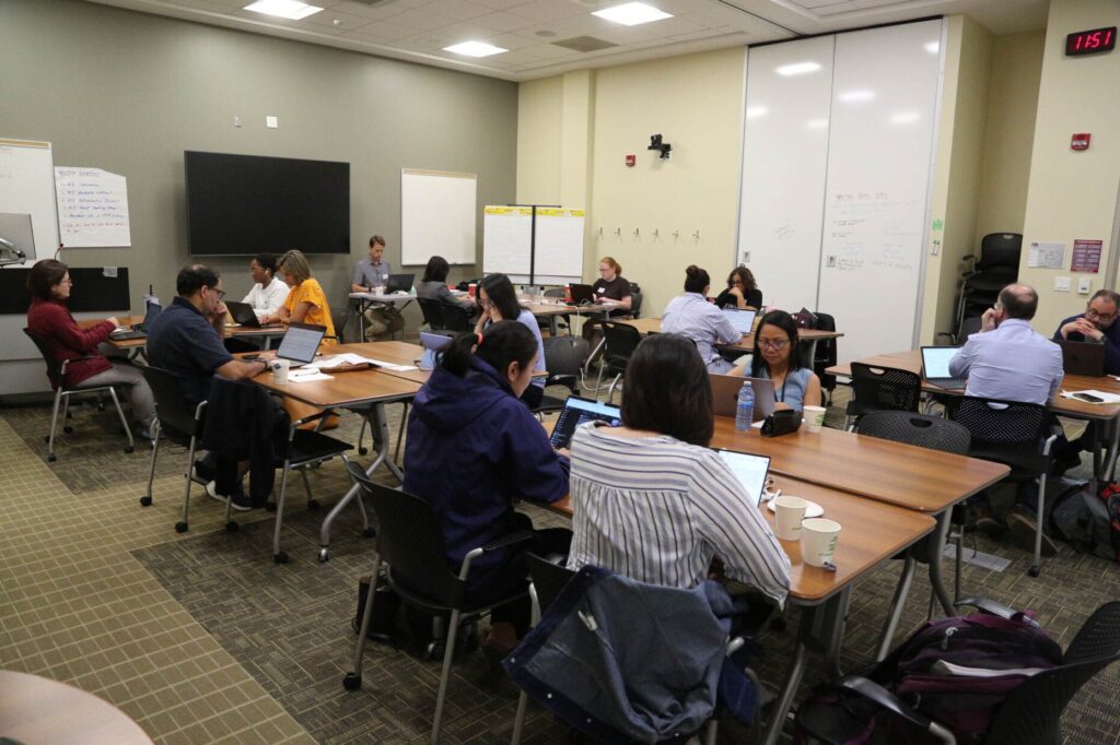 Educators working on their research projects at the Writing Retreat event—one of a number of strategic supports for Teaching Stream faculty delivered by the MacPherson Institute.