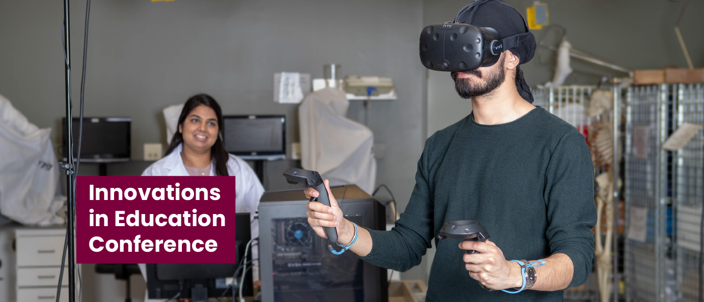 Person in lab coat watching a person with virtual reality goggles and a joystick gesturing.